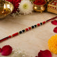 Red Black Thread Rakhi with White Beads 