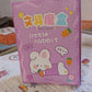 Cartoon school box with stationery items and refill pens