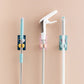 Self-adhesive mop and broom organizer for space-saving storage.