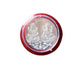 Pooja Coin with packaging displayed on cloth
