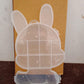 Clear plastic storage box with cartoon bear design.
