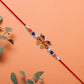 Vibrant Butterfly Rakhi With Colorful Beads  Red Mauli Thread