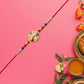 Designer Floral Rakhi With Mirror Work  Colorful Beads On Red Thread