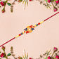 Designer Sun Motif Rakhi With Red And Blue Enamel Work