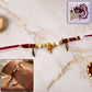 Ganesh Charm Rakhi with Feather Pendants