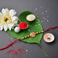 Sacred Kalash Design Rakhi With Embellished Beads And Red Thread