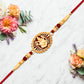 Traditional Ganesha Rakhi With Golden Finish And Sacred Red Thread