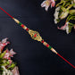Religious Ganesha Rakhi In Gold Finish